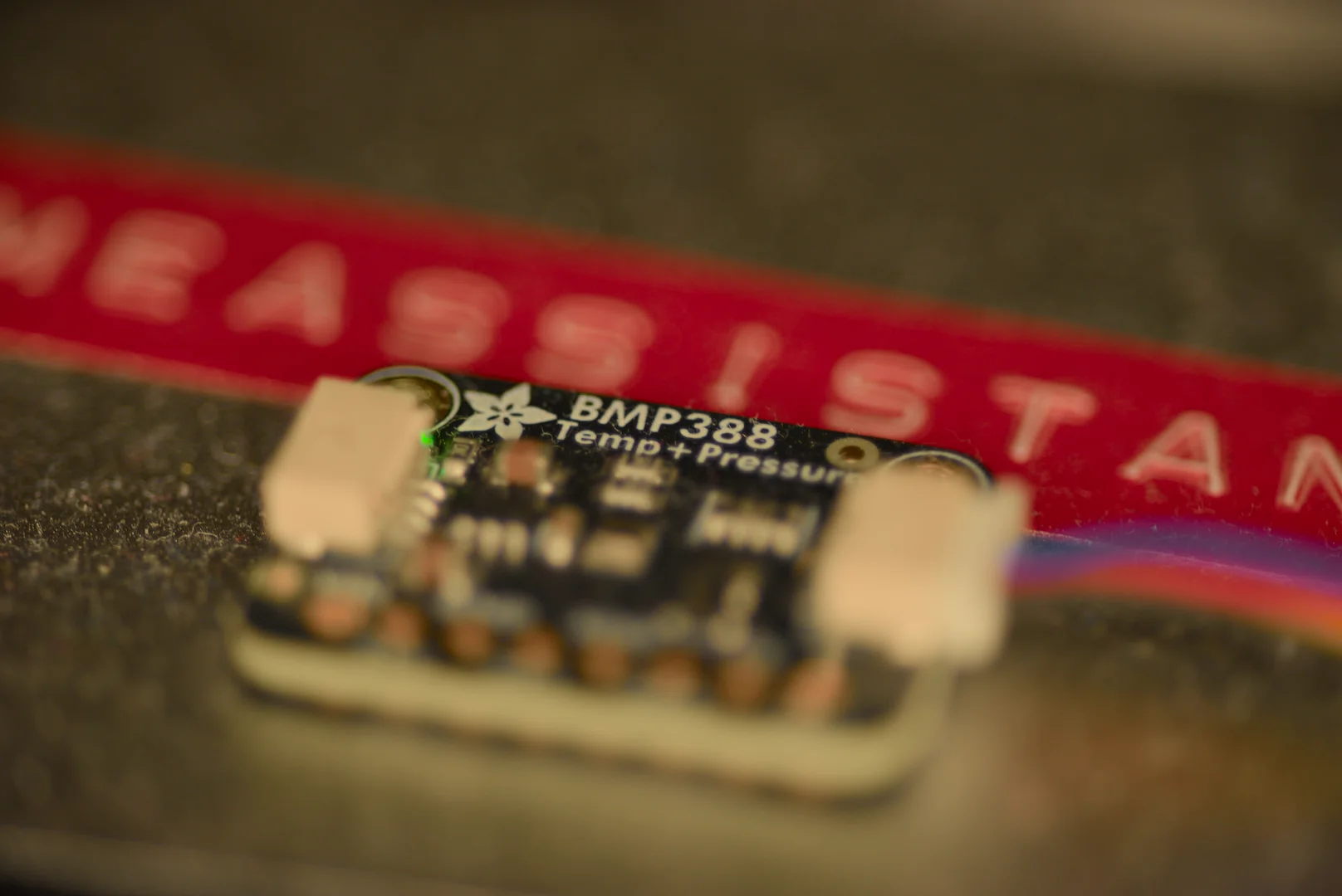 Close-up of a small sensor electronics board and its connector