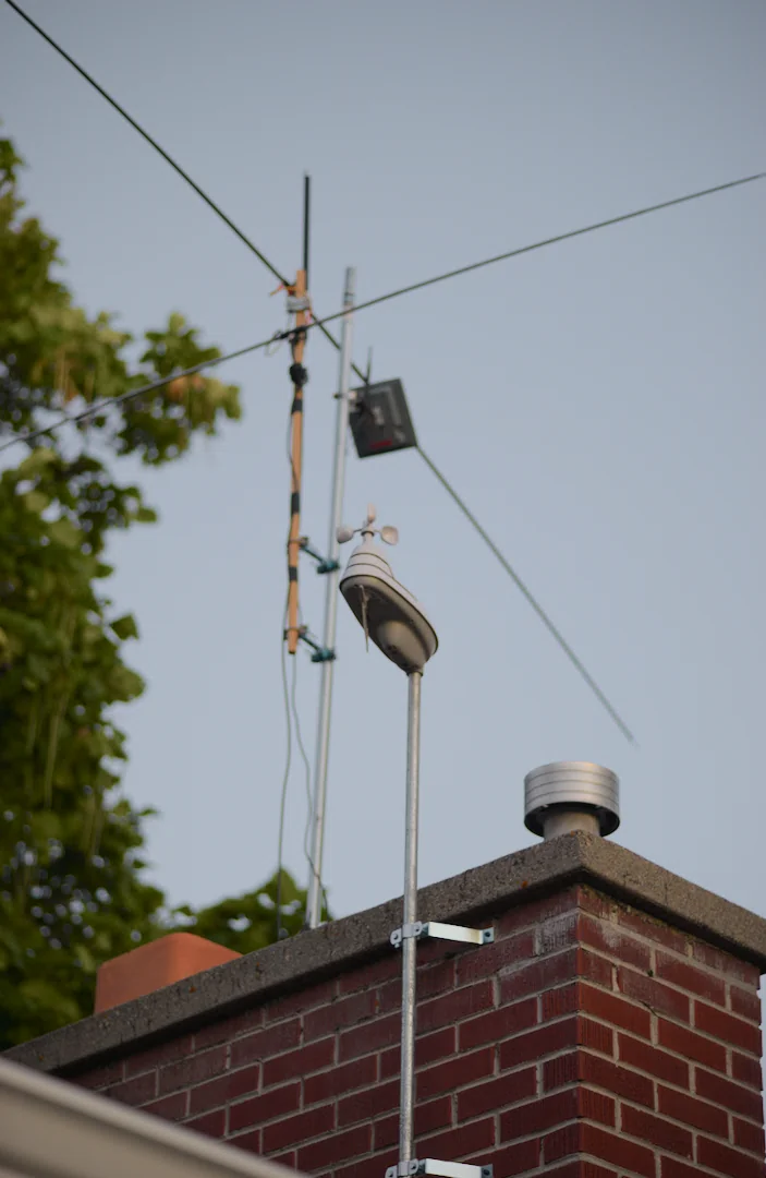 Antenna mast and roofline near the weather station